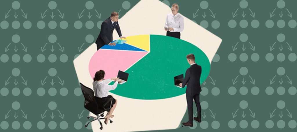 Four people dressed in business attire sit around a colourful pie chart made to look like a work table. Three stand while one woman sits in a rolling chair with her laptop on the table.